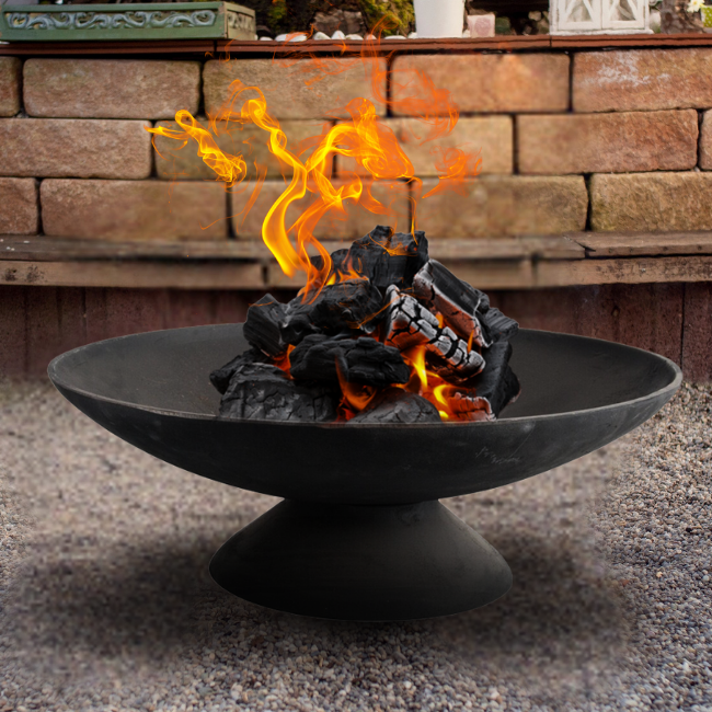 A blazing fire in the Rustic Glow Firepit Bowl, showcasing its 22" diameter for a hearty and warming fire perfect for outdoor gatherings.